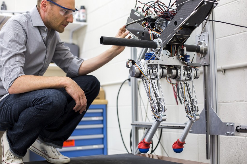 David Remy, ME Professor, works in the Robotics and Motion Laboratory (RAMLab) in the GG Brown Building, testing the research group's new robot, Ramone, on May 27, 2014.  Photo: Joseph Xu, Michigan Engineering Communications & Marketing   www.engin.umich.edu