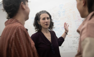 Dr. Trudy Oliver, center, speaks with some of her graduate students in the Duke Cancer Biology department.